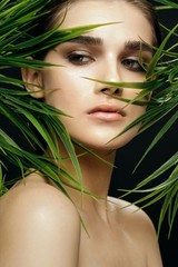 Fototapeta premium beautiful woman green leaves charm tropics