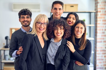 Group of business workers smiling happy and confident. Posing together with smile on face looking...