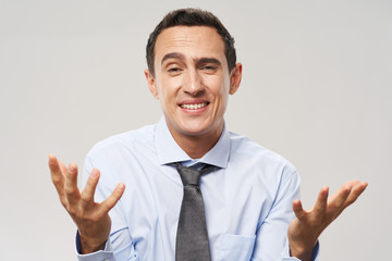 portrait of a handsome young man showing thumbs up