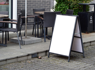 Blank poster stand for outdoor restaurant - obrazy, fototapety, plakaty
