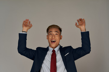 businessman with his arms raised