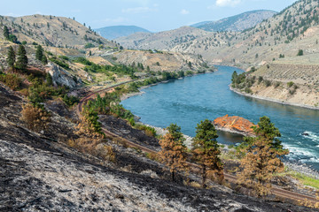 Fire damage near the railroad tracks running along the Thompson River near Spences Bridge in...
