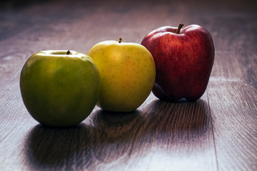 Apples on wooden background