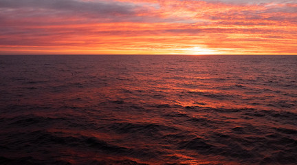 Beautiful red-coloured sunset observed from fishing vessel in the South Atlantic.