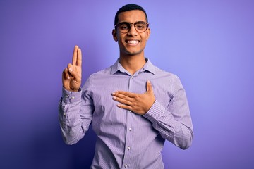 Handsome african american man wearing striped shirt and glasses over purple background smiling...