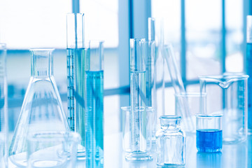 Science laboratory test tubes. Liquid substance in equipment glassware for chemistry biology samples. Research development for analysis scientific. Blue tone, healthcare and medical concept.