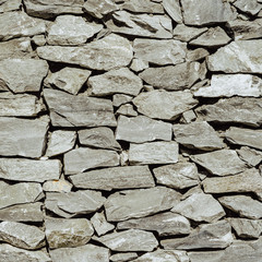 backdrop and texture of granite stone wall surface.