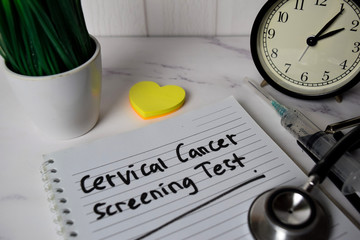 Cervical Cancer Screening Test write on a book and keyword isolated on Office Desk. Healthcare/Medical Concept