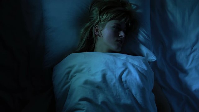 Frustrated girl cant falling asleep, thinking about her loneliness and breakup