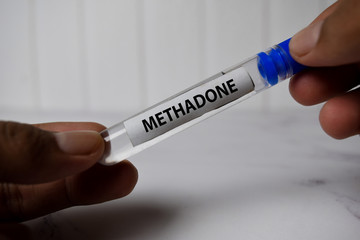 Methadone text on tube bottle. Top view isolated on office desk. Healthcare/Medical concept