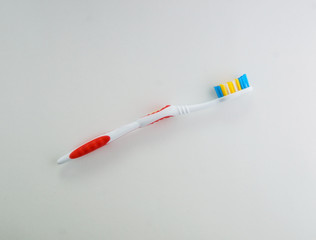 multicolored toothbrush on a white background