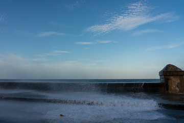 Sea water in the street as a result of waves crashing into the Maleco wall. Havana. Cuba.