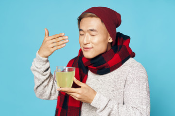 young man with a cup of tea