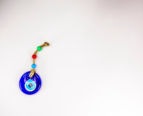 Pretty Turkish evil eye pendants isolated against a white background