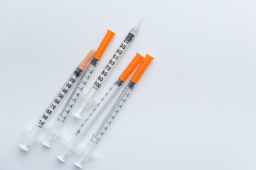 Syringe with a transparent vaccine isolated on white background