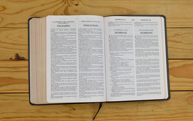 open bilingual bible book on Philemon and Hebrews, Spanish and english 