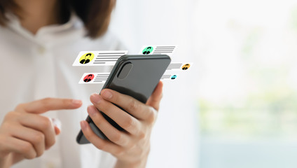 woman hand typing text message on online social and showing icon on screen.