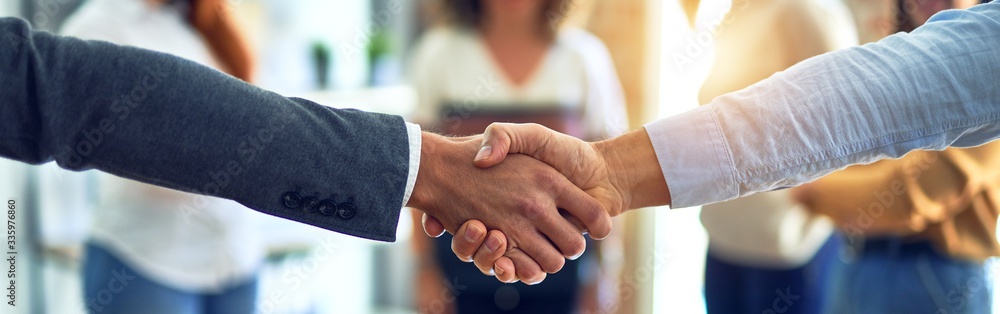 Sticker Group of business workers standing together shaking hands at the office