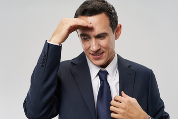 businessman with his hands on his head