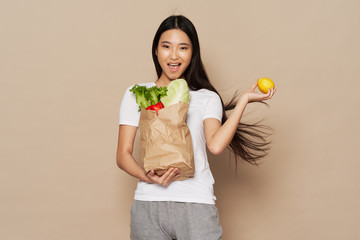 young woman holding shopping bag