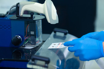 DNA laboratory. The expert puts the human DNA into the database using advanced laboratory technologies