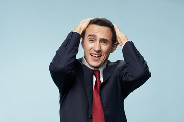 businessman with his hands on his head