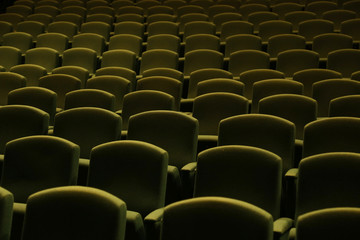 Green velvet seat in a theater