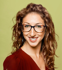 Woman with Curly hair and Glasses Smiling