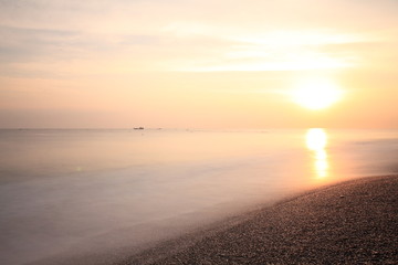 Long exposure sunrise seascape with Chinese fishing junks in the background