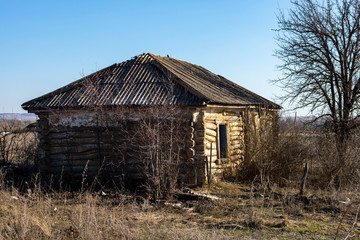 Old small abandoned and ruinous country house