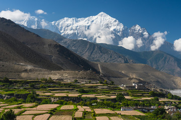Fototapeta na wymiar Nilgiri mountain peak behind Kagbeni village in Upper Mustang, Himalaya mountain range in Nepal