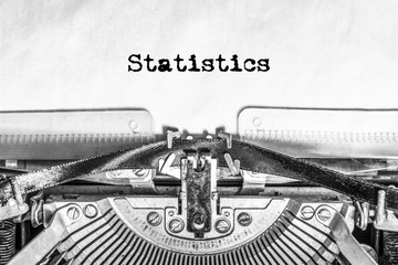Statistics text typed on a vintage typewriter. Old paper, history