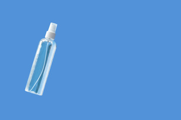Transparent hand sanitizer in the transparent spray bottle on the plain background virus caution actions