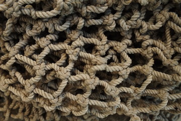 background macro image of a braided fishing net with large meshes