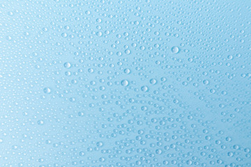 Water droplets on blue background.