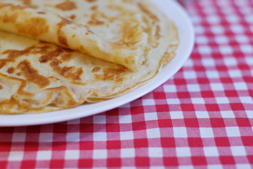 Delicious fried pancakes Russian cuisine on a plate on the table.