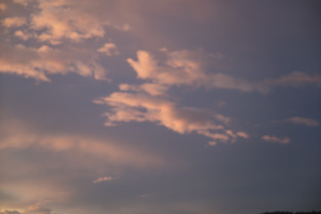 Naklejka na ściany i meble Purple sky at sunset, stratocumulus clouds. Abstract sky