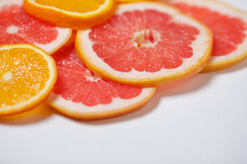 Naklejka na ściany i meble Oranges and grapefruits, chopped