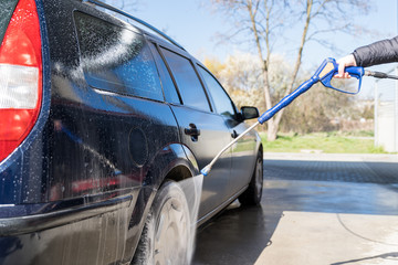 manual car wash by spraying treated water under high pressure. self-service fast car wash