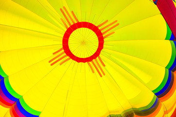 Albuquerque, New Mexico is considered to be the hot air ballooning capital of the world. The flag of New Mexico and red Zia sun symbol is displayed on a hot air balloon. © Brett