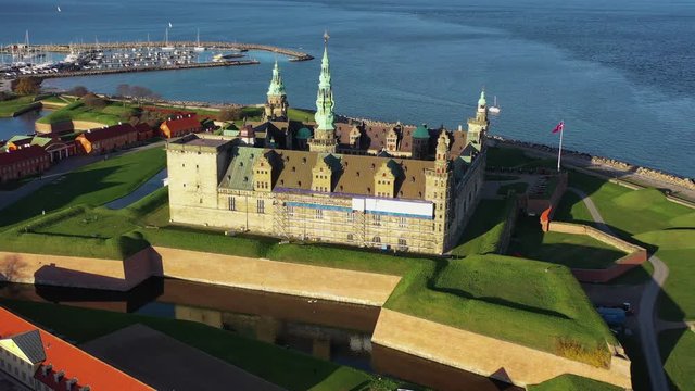 Drone 4K footage of ancient Kronborg Castle in Elsinore in the top of Zeeland Island north of Copenhagen home of Shakespeare's Hamlet (To Be Or Not To Be That is The Question) Denmark Flag Dannebrog
