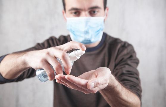 Man Hand Using Wash Hand Sanitizer Gel. Coronavirus. Hygiene