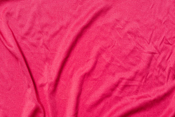 red silk sheet with creases