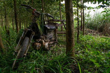 Motorbike abandoned in the forest vietnam