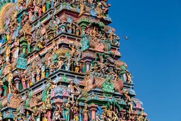 Hindu temple in Tamil Nadu, South India.  Sculptures on Hindu temple gopura (tower), sculpture of an Indian deity