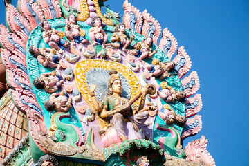 Fototapeta premium Hindu temple in Tamil Nadu, South India. Sculptures on Hindu temple gopura (tower), sculpture of an Indian deity