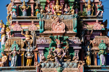 Obraz premium Hindu temple in Tamil Nadu, South India. Sculptures on Hindu temple gopura (tower), sculpture of an Indian deity