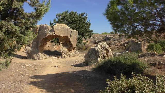 Trees among the ruins of the necropolis. Royal Tombs near Paphos