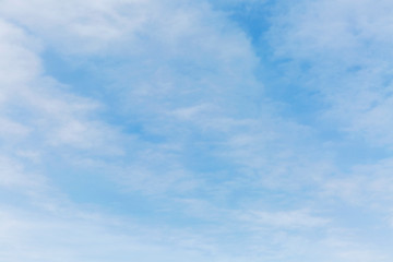 Bright blue sky in the clouds on a sunny day. Space for text. Background.