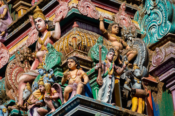 Hindu temple in Tamil Nadu, South India.  Sculptures on Hindu temple gopura (tower), sculpture of an Indian deity